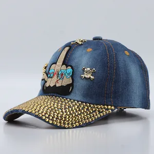 Denim baseball cap with rhinestone brim, skull studs, and middle finger embroidery patch
