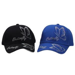 Women's cotton baseball caps in black and royal blue with rhinestone butterfly patterns