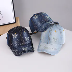 Denim rhinestone baseball caps with butterfly patterns in three blue denim shades
