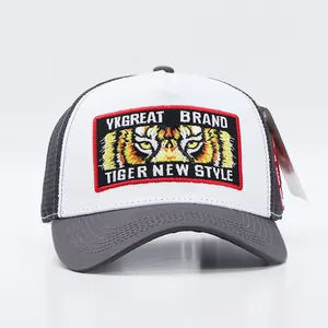 Detail of high-quality embroidery with tiger eye motif on the front of a trucker hat