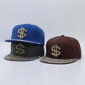Detailed view of three flat brim hip hop caps featuring gold rhinestone dollar sign logos