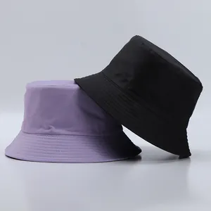 Detail of lavender and black bucket hats showing durable twill texture and brim stitching