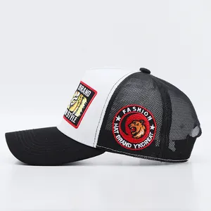 Close-up of tiger embroidery and mesh detail on a black and white trucker hat