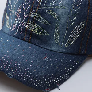 Detailed macro of washed denim baseball cap with rainbow rhinestones and distressed brim