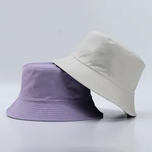 Minimalist cotton bucket hats in purple and beige with quilted brims for sun protection