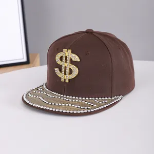 Detail of flat brim baseball cap with gold rhinestone dollar sign and studded visor