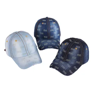 Three denim baseball hats with rhinestone miu patterns in light, medium and dark blue denim