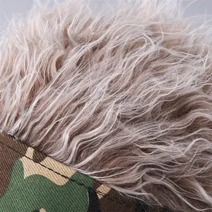 Macro detail of camouflage wig hat showing premium synthetic hair and durable canvas stitching