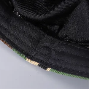 Detailed macro view of the camouflage brim and black fabric lining of this hip-hop beanie