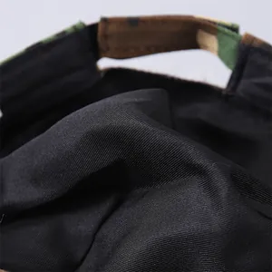 Detail showing the camouflage adjustment strap and black twill fabric inside the cap