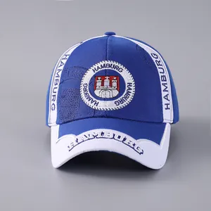 Close-up of Hamburg city emblem and white text embroidery on a blue cotton baseball cap