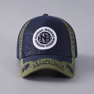 Close-up of Nassau Bahamas embroidery on navy and olive green baseball cap detail