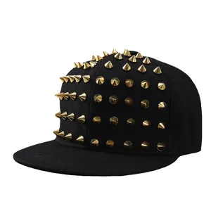 Flat brim baseball cap in black cotton with decorative gold metal cone studs