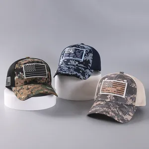 Three tactical camouflage mesh baseball caps with American flag patches on display