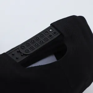 Close-up of black cotton flat brim cap with adjustable plastic snapback fastener