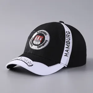 Close-up of Hamburg embroidery and embossed letter details on the baseball cap