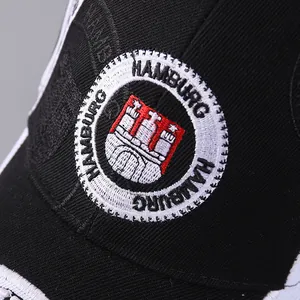 Close-up of fine embroidery showing the Hamburg crest on a black twill baseball cap