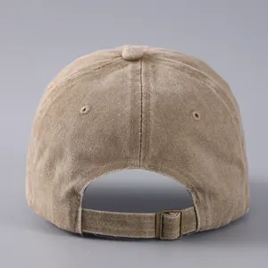 Detailed back view of vintage khaki cotton baseball cap showing the metal buckle strap
