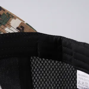 Detail view of the breathable mesh interior and 100% cotton label of the camouflage cap