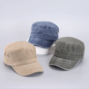 Detailed trio of washed cotton cadet caps in khaki, blue, and grey with metal eyelets