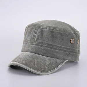 Detailed close-up of army green cadet cap showing washed canvas texture and metal eyelets
