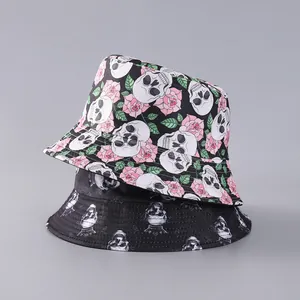 Detail of gothic bucket hats featuring skull and rose prints on black fabric texture