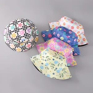 Flat lay showing five patterned bucket hats featuring floral, checkerboard and mushroom prints