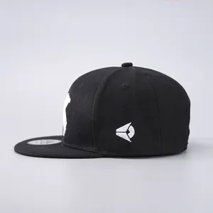 Side view of black cotton flat brim hip hop hat with detailed white geometric embroidery