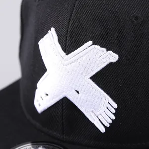 Close-up of premium 3D white embroidery on a black cotton twill hip hop baseball cap