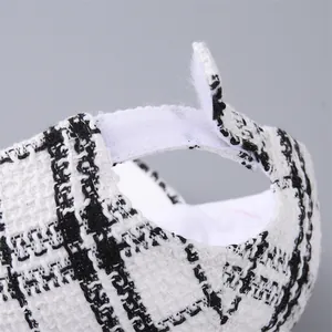 Black and white houndstooth tweed baseball cap with adjustable Velcro strap detail