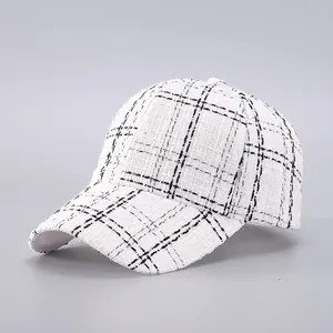 Classic houndstooth tweed baseball cap in black and white checkers with a curved brim