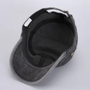 Detail of internal sweatband and 100% cotton label on washed denim flat top cadet cap