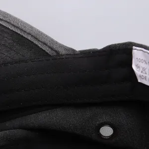 Detailed macro view of black cotton army cap interior with sweatband and mesh metal eyelet