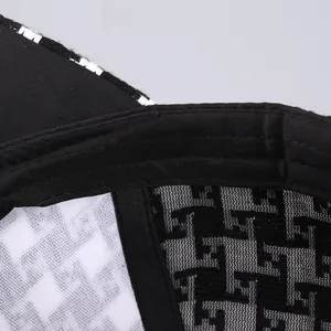 Detailed macro view of the inner stitching and houndstooth lining of the baseball cap