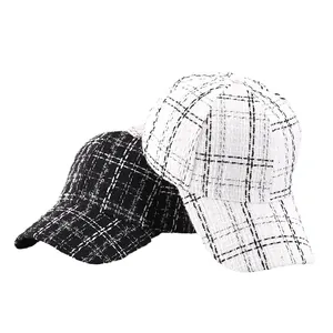 Classic houndstooth tweed baseball cap in black and white woven pattern for women