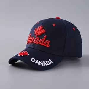 Detailed embroidery of Canada script and maple leaf on navy cotton baseball cap