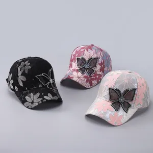 Lace baseball caps with mesh butterflies and rhinestones in various colors display