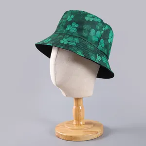 Detailed close-up of a double-sided green bucket hat with clover print on a mannequin head