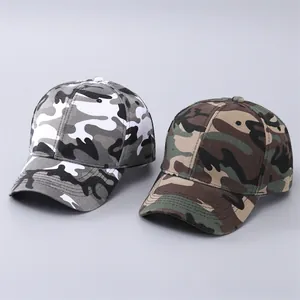 Detail view of two camouflage baseball caps in grey and jungle green patterns