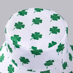 White bucket hat with green clover print shown from a top-down perspective view