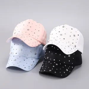 Detail of studded baseball caps in four colors featuring silver star-shaped metal rivets