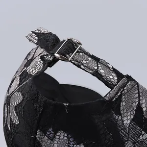 Detail of adjustable silver buckle and lace pattern on the back of the baseball cap