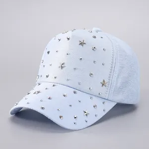 Front view of light blue baseball cap with silver star and dot metal rivet studs