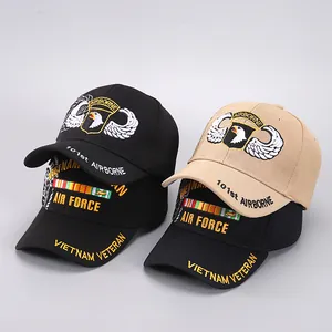 Detail of 101st Airborne eagle embroidery and Vietnam Veteran text on baseball caps
