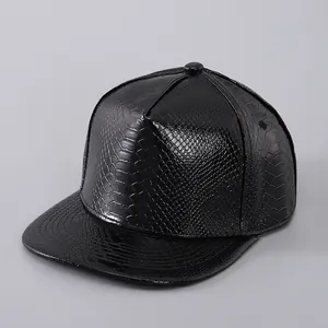 Detailed macro shot of the textured faux leather and stitching on the black snapback cap
