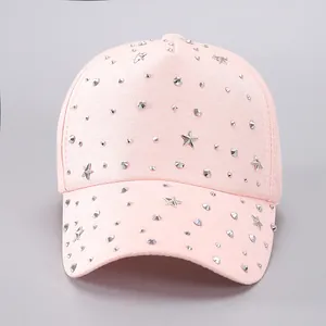 Detail of light pink baseball cap with silver rivets and metallic star-shaped studs