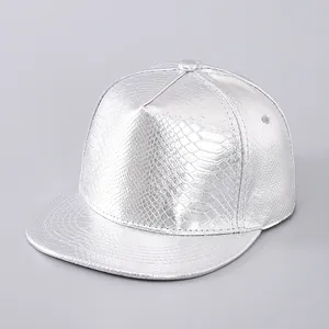 Detailed view of silver snapback hat with textured faux snake skin finish and metallic shine