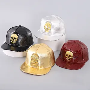 Detailed view of PU leather snapback hats with metallic skull and rhinestone accents