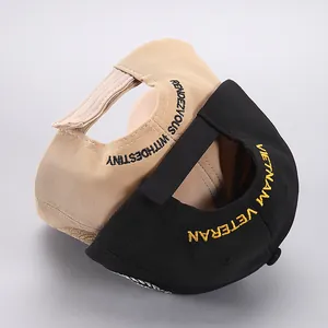 Detail of adjustable velcro strap and military embroidery on khaki and black baseball caps