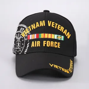 Detailed close-up of 3D yellow embroidery and badges on a black cotton baseball cap